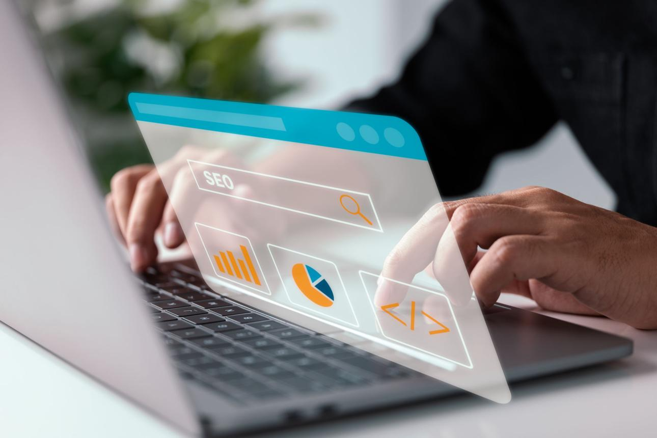 SEO analytics dashboard showing website performance, keyword rankings, and growth charts on a laptop screen